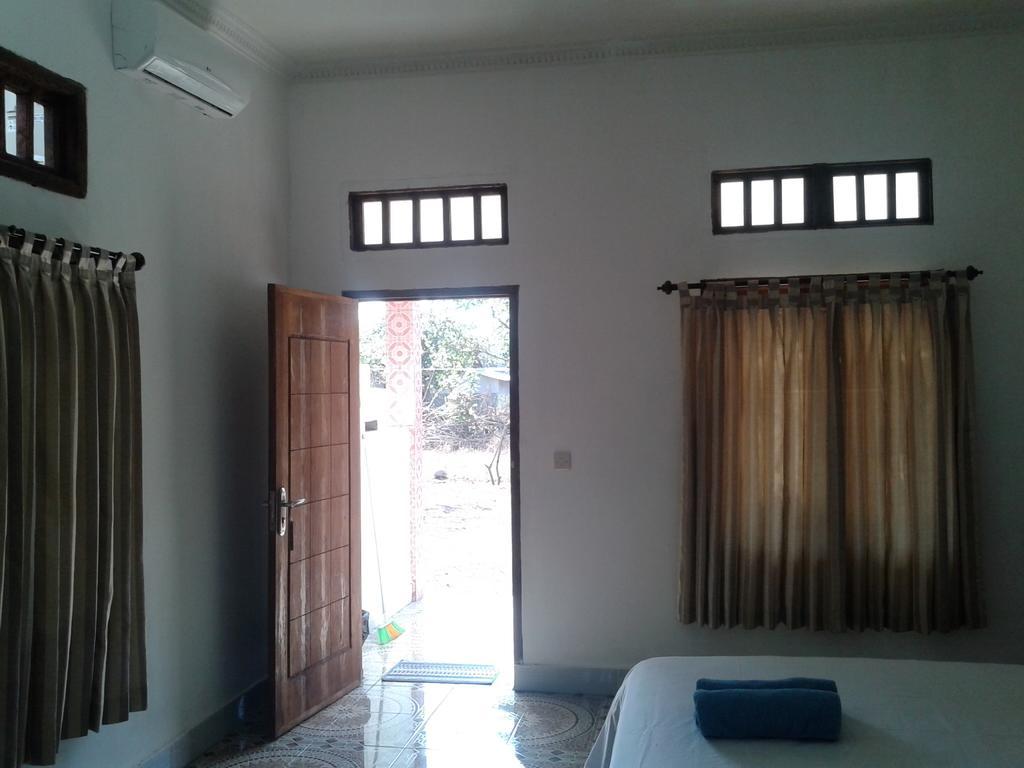Putri Homestay Гили-Мено Номер фото