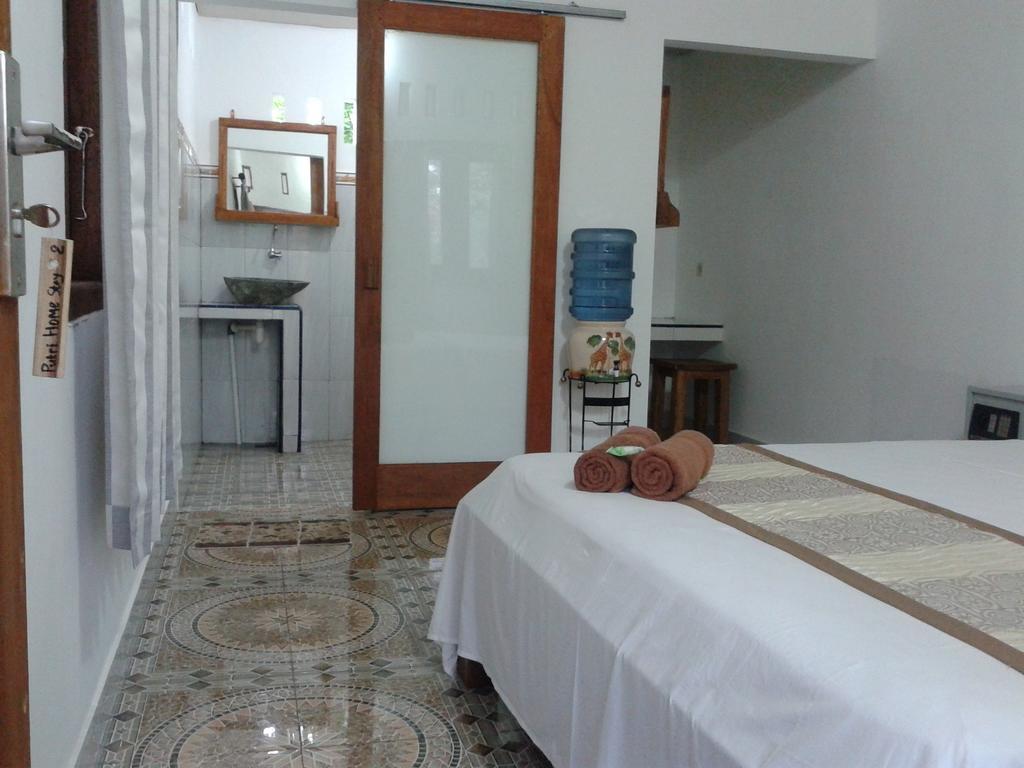 Putri Homestay Гили-Мено Номер фото
