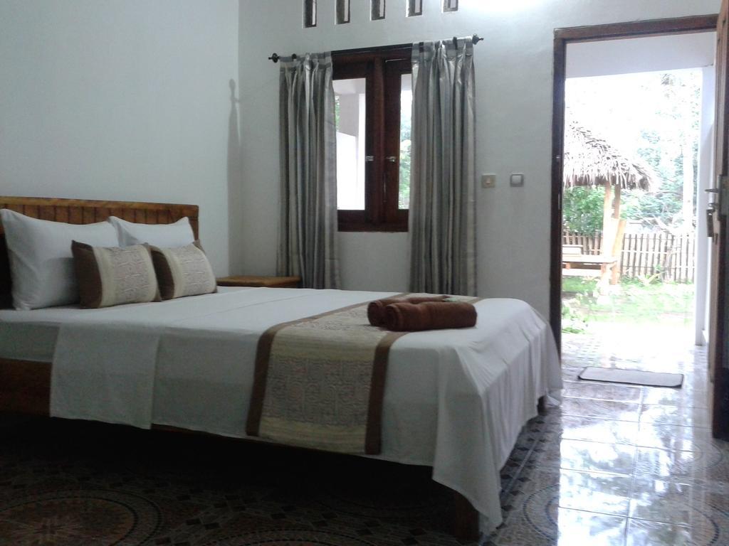 Putri Homestay Гили-Мено Номер фото